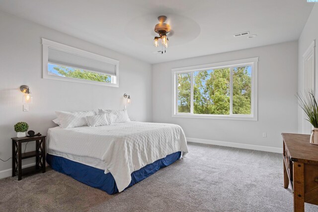 carpeted bedroom featuring ceiling fan