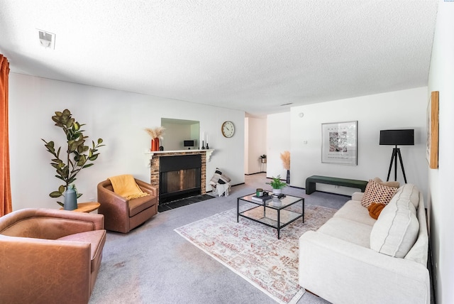 2912 W Hood Ave Unit B203, Kennewick, WA 99336 - living area featuring carpet flooring, a fireplace with flush hearth, and a textured ceiling