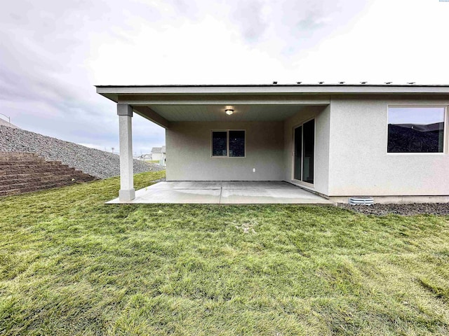 6150 W 30th Pl, Kennewick, WA 99338 - back of house featuring a patio, a yard, and stucco siding