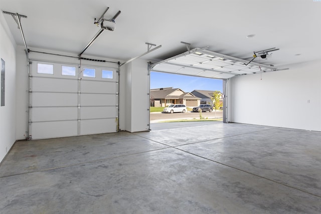 garage featuring a garage door opener and a carport