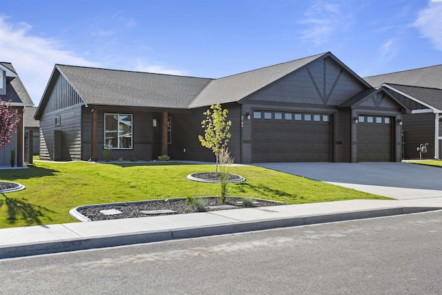 view of front facade featuring a garage and a front yard