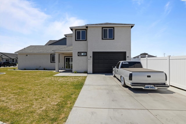 rear view of property with a garage and a lawn