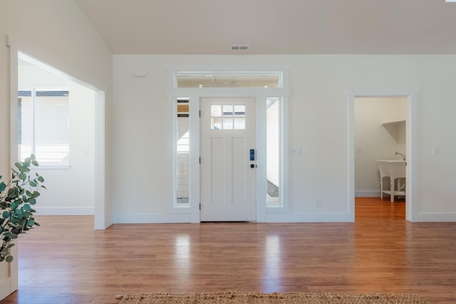 foyer entrance with light wood-type flooring