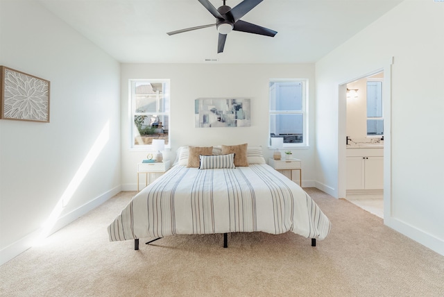 1125 Bordeaux St, Prosser, WA 99350 - bedroom featuring ceiling fan, ensuite bath, and light carpet
