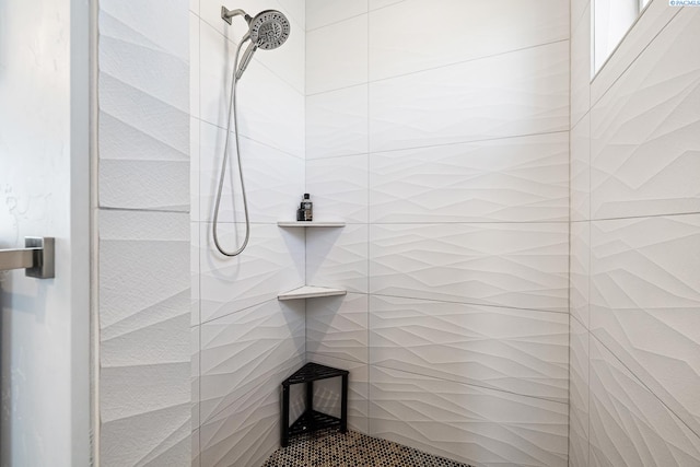full bathroom with tiled shower