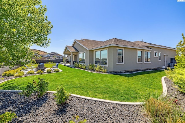 rear view of property with stucco siding