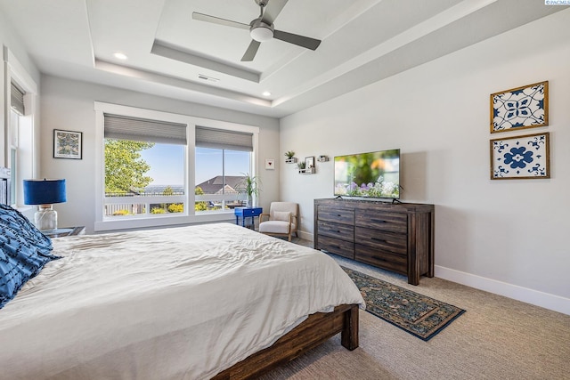 bedroom with carpet flooring, baseboards, a tray ceiling, recessed lighting, and a ceiling fan