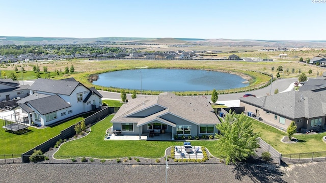 aerial perspective of suburban area featuring a nearby body of water