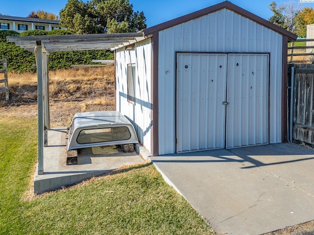 view of outbuilding with a lawn