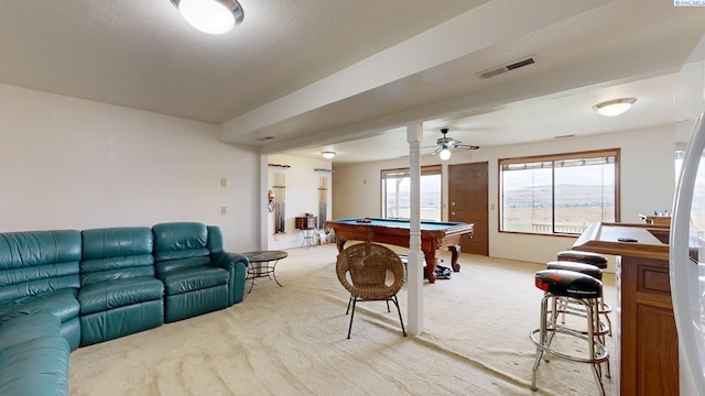 rec room with ceiling fan, pool table, light colored carpet, and a textured ceiling