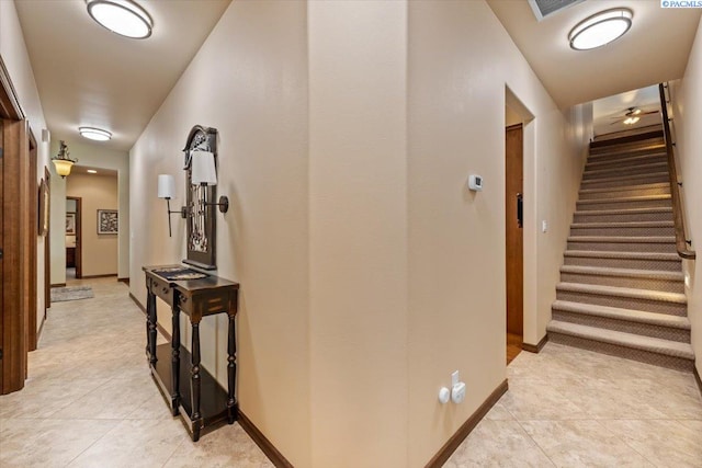 404 S Georgia St, Kennewick, WA 99338 - hall featuring baseboards, light tile patterned flooring, stairway, and visible vents