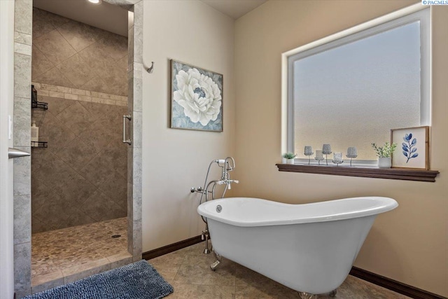 404 S Georgia St, Kennewick, WA 99338 - bathroom featuring a freestanding tub, a shower stall, baseboards, and tile patterned floors