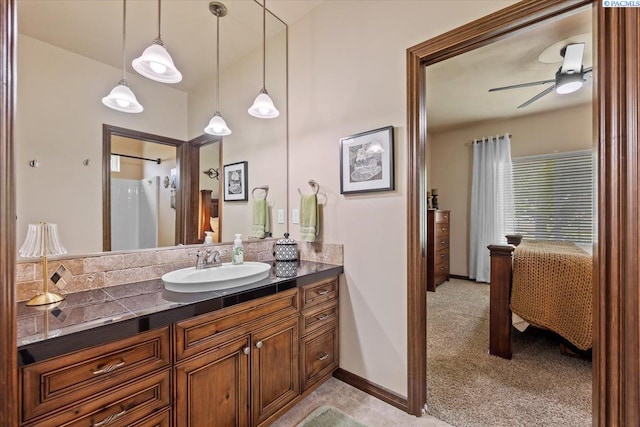 404 S Georgia St, Kennewick, WA 99338 - bathroom featuring a ceiling fan, baseboards, and vanity