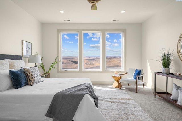 carpeted bedroom with recessed lighting, visible vents, and baseboards