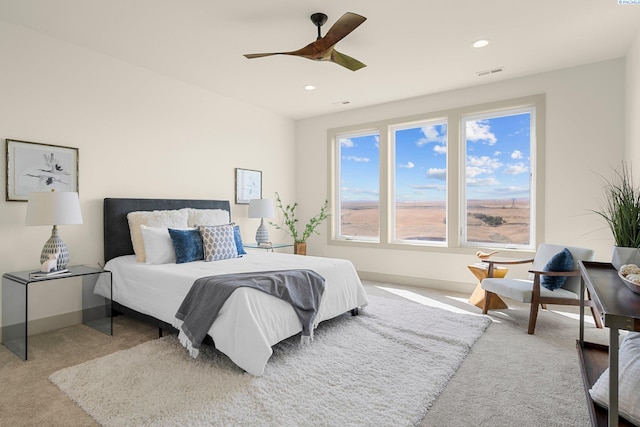 carpeted bedroom featuring baseboards, visible vents, ceiling fan, and recessed lighting