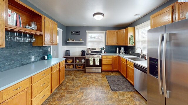 kitchen with sink, backsplash, and stainless steel appliances