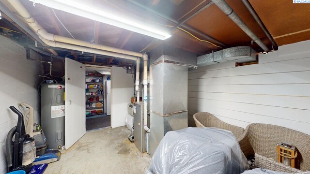 basement featuring electric water heater