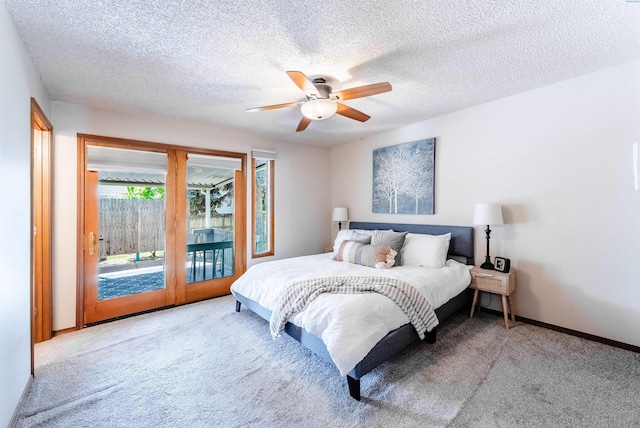bedroom with access to outside, a ceiling fan, carpet, baseboards, and a textured ceiling