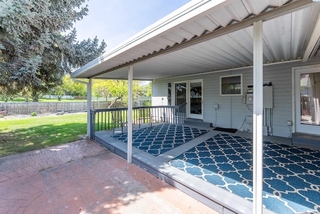 view of patio featuring fence and a wooden deck