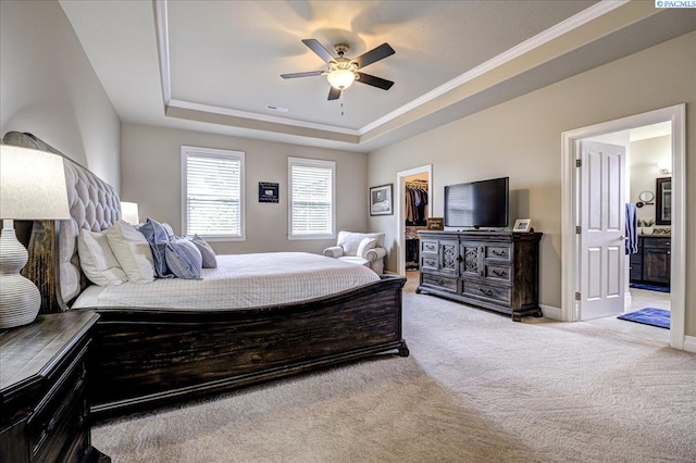 87021 Summit View Dr, Kennewick, WA 99338 - carpeted bedroom with a raised ceiling, a walk in closet, ornamental molding, baseboards, and a ceiling fan