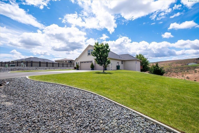 87021 Summit View Dr, Kennewick, WA 99338 - view of property exterior with concrete driveway and stucco siding
