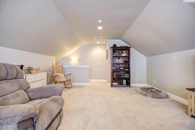 87021 Summit View Dr, Kennewick, WA 99338 - sitting room featuring a textured ceiling, light carpet, lofted ceiling, baseboards, and an upstairs landing