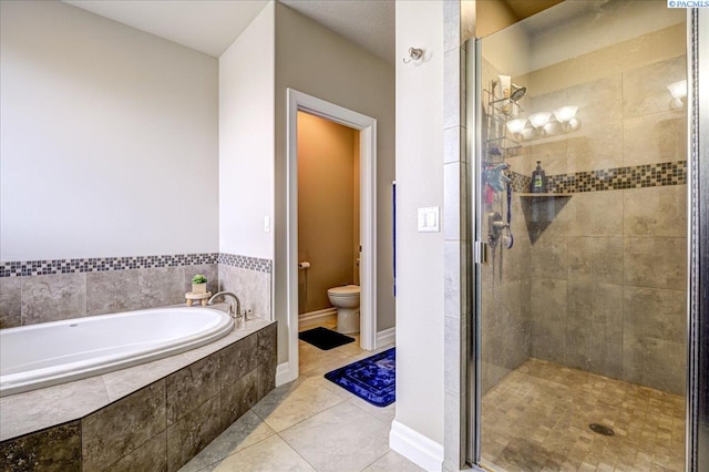 87021 Summit View Dr, Kennewick, WA 99338 - full bathroom featuring a garden tub, a shower stall, tile patterned floors, and toilet