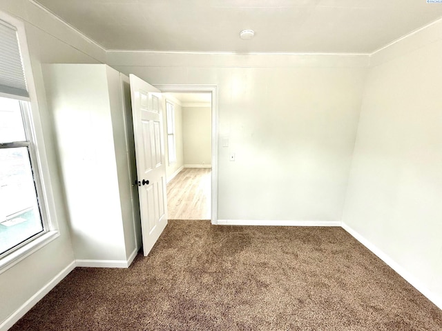 419 W A Ave, Colfax, WA 99111 - carpeted spare room with ornamental molding, baseboards, and a smoke detector