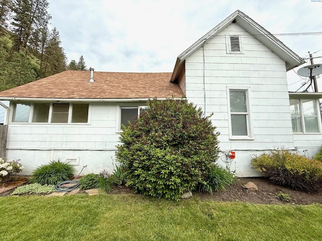 419 W A Ave, Colfax, WA 99111 - view of property exterior with a shingled roof and a yard