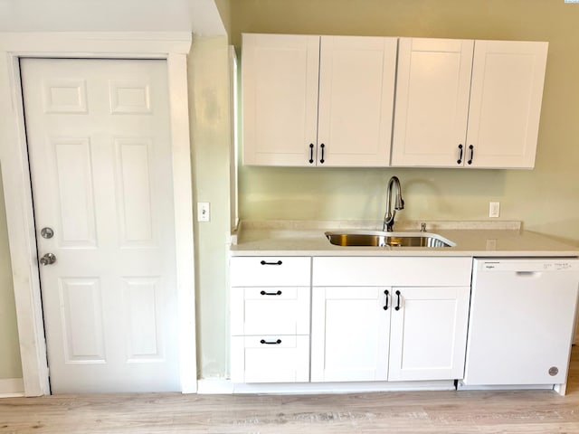419 W A Ave, Colfax, WA 99111 - kitchen featuring dishwasher, a sink, light countertops, and white cabinets