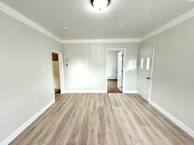 419 W A Ave, Colfax, WA 99111 - empty room with light wood-style floors, baseboards, and a smoke detector