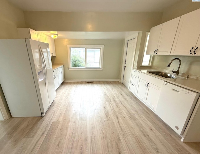 419 W A Ave, Colfax, WA 99111 - kitchen featuring white appliances, a sink, light wood finished floors, and white cabinets