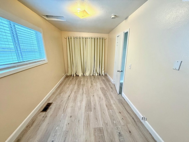 419 W A Ave, Colfax, WA 99111 - unfurnished room featuring wood finished floors, baseboards, and a smoke detector