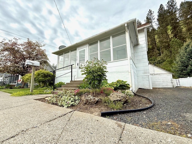 419 W A Ave, Colfax, WA 99111 - view of side of home featuring a sunroom