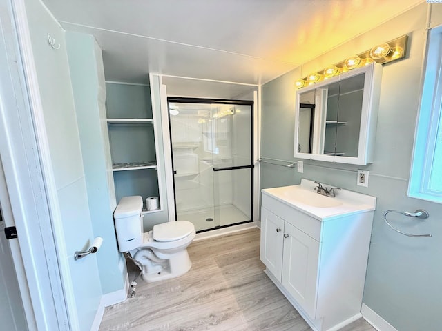 419 W A Ave, Colfax, WA 99111 - bathroom with vanity, a shower stall, toilet, and wood finished floors