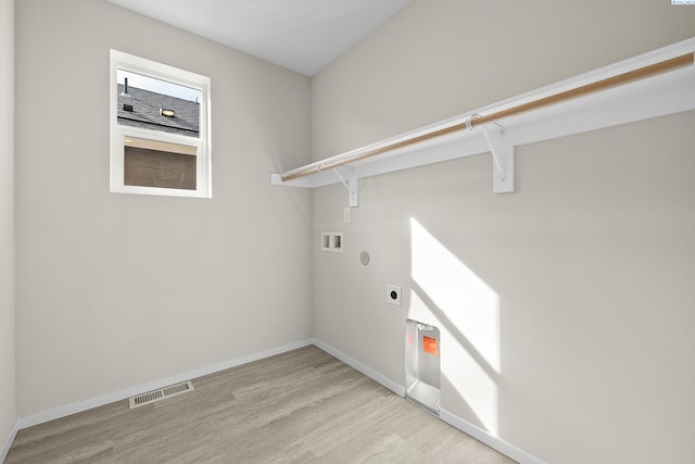 688 S Zeelar St, Kennewick, WA 99336 - clothes washing area with electric dryer hookup, washer hookup, light wood-type flooring, and baseboards