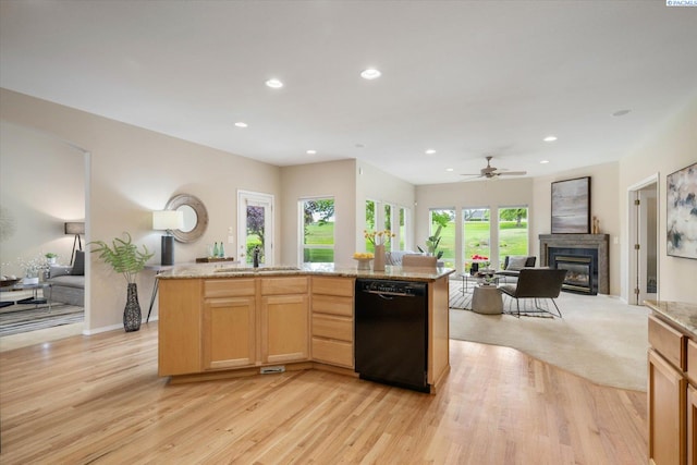 1209 W Canyon Lakes Dr, Kennewick, WA 99337 - kitchen with black dishwasher, open floor plan, a glass covered fireplace, light wood finished floors, and recessed lighting