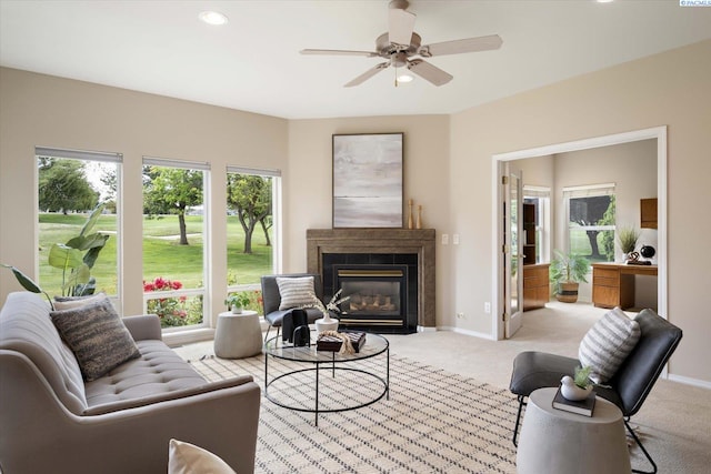 1209 W Canyon Lakes Dr, Kennewick, WA 99337 - living room with light carpet, a glass covered fireplace, a ceiling fan, and recessed lighting