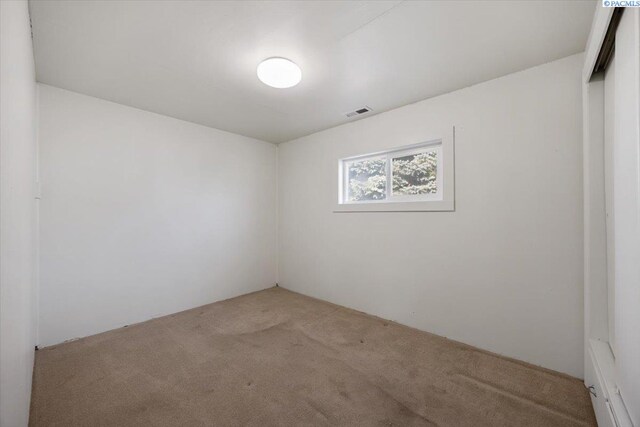 spare room with light colored carpet