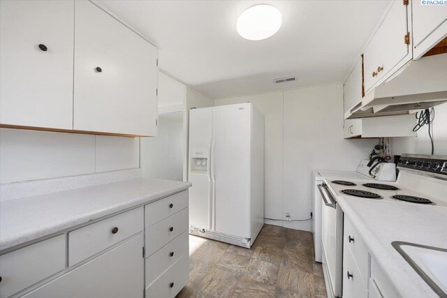 kitchen featuring sink, white appliances, and white cabinets