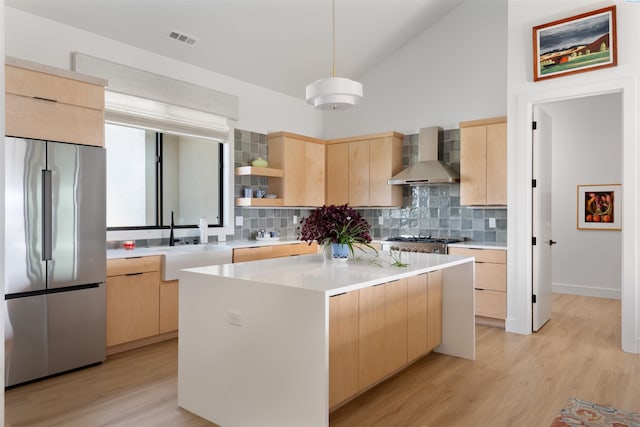 7004 Ricky Rd, Pasco, WA 93301 - kitchen featuring visible vents, light brown cabinets, open shelves, stainless steel fridge, and wall chimney exhaust hood