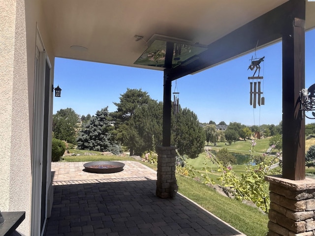 3405 S Johnson St, Kennewick, WA 99337 - view of patio / terrace with an outdoor fire pit and view of wooded area