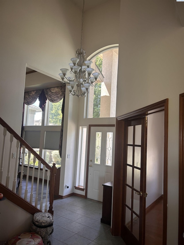 3405 S Johnson St, Kennewick, WA 99337 - foyer entrance featuring a towering ceiling, a chandelier, stairs, and tile patterned floors
