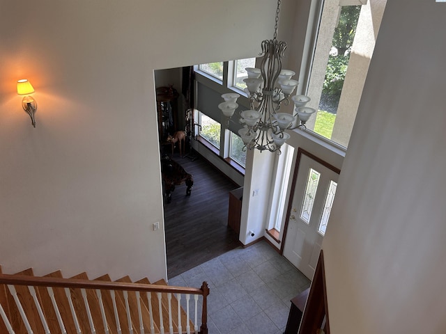 3405 S Johnson St, Kennewick, WA 99337 - foyer with a chandelier, dark tile patterned flooring, and healthy amount of natural light