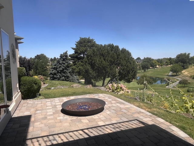 3405 S Johnson St, Kennewick, WA 99337 - view of patio with an outdoor fire pit and a water view