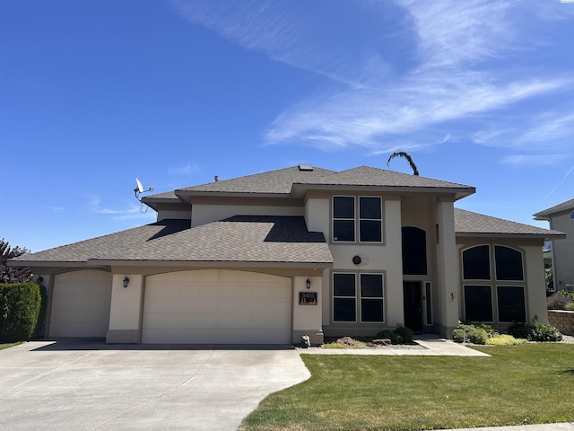 3405 S Johnson St, Kennewick, WA 99337 - view of front facade featuring stucco siding, an attached garage, concrete driveway, and a front yard