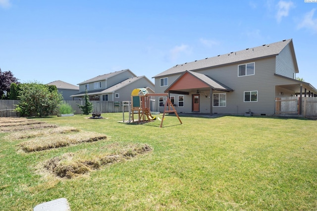 8414 W 3rd Ave, Kennewick, WA 99336 - back of property featuring a playground, a fenced backyard, crawl space, and an outdoor fire pit