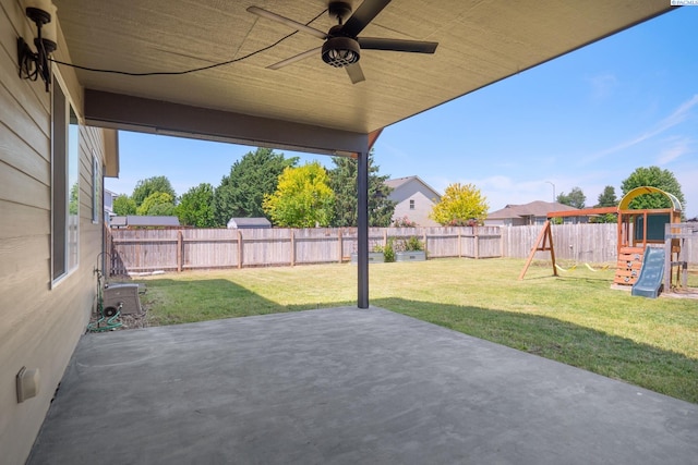 8414 W 3rd Ave, Kennewick, WA 99336 - fenced backyard featuring a playground, a patio, and a ceiling fan