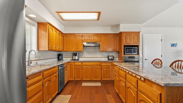 151002 W Richards Rd, Prosser, WA 99350 - kitchen featuring appliances with stainless steel finishes, dark wood-type flooring, and brown cabinets