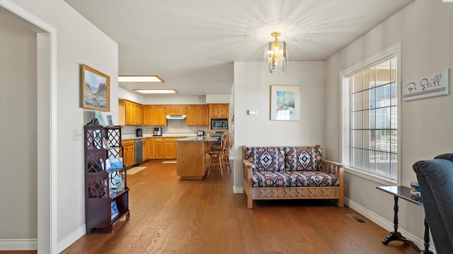 151002 W Richards Rd, Prosser, WA 99350 - living area featuring wood finished floors, healthy amount of natural light, and a chandelier